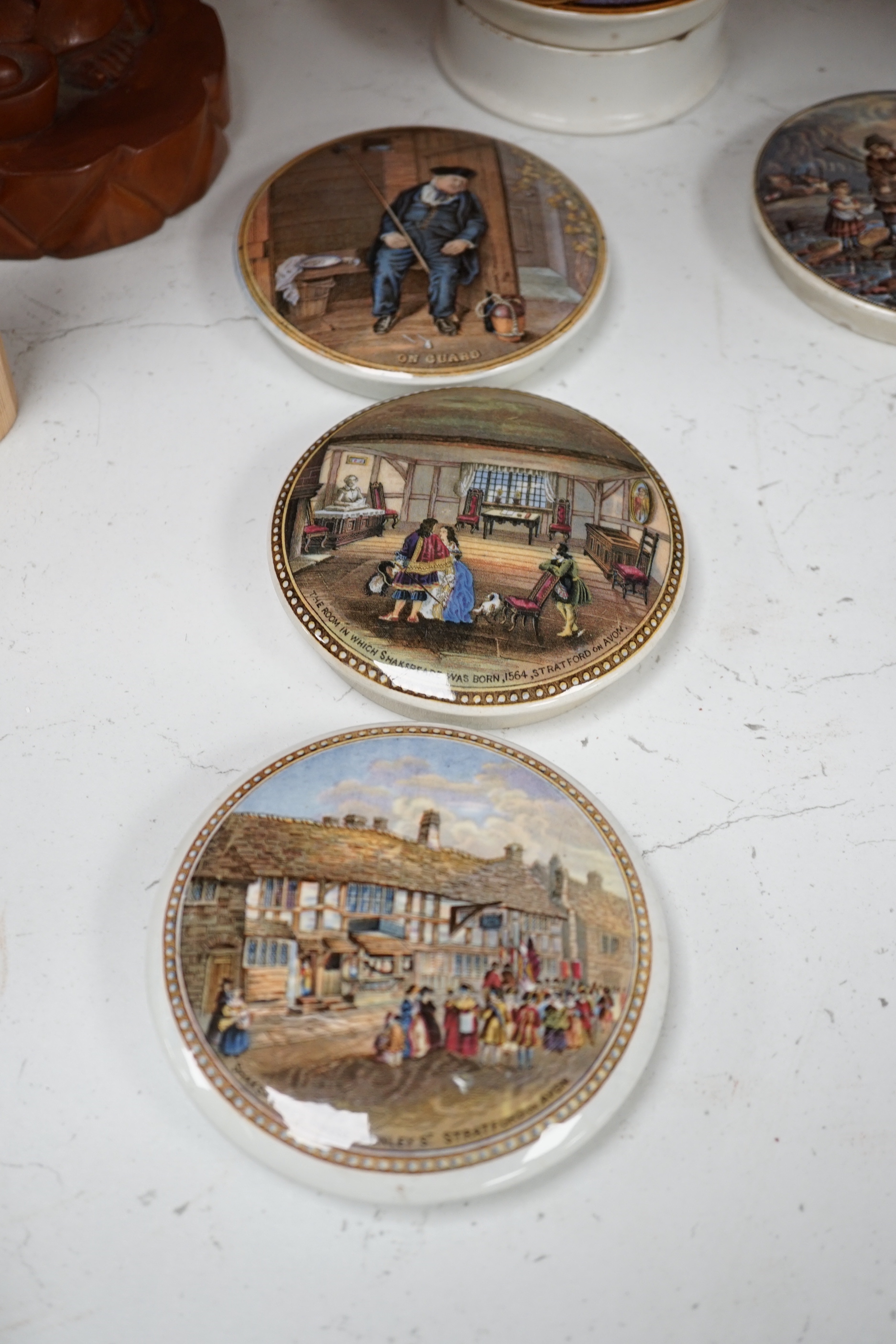 Eight Victorian ceramic Prattware pot lids, six with Shakespeare themes and a jar and cover, largest 12cm in diameter